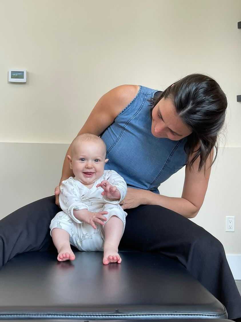 287806296_560284875660455_6769896849606317061_n Pediatric chiropractor providing gentle care to an infant in Vancouver